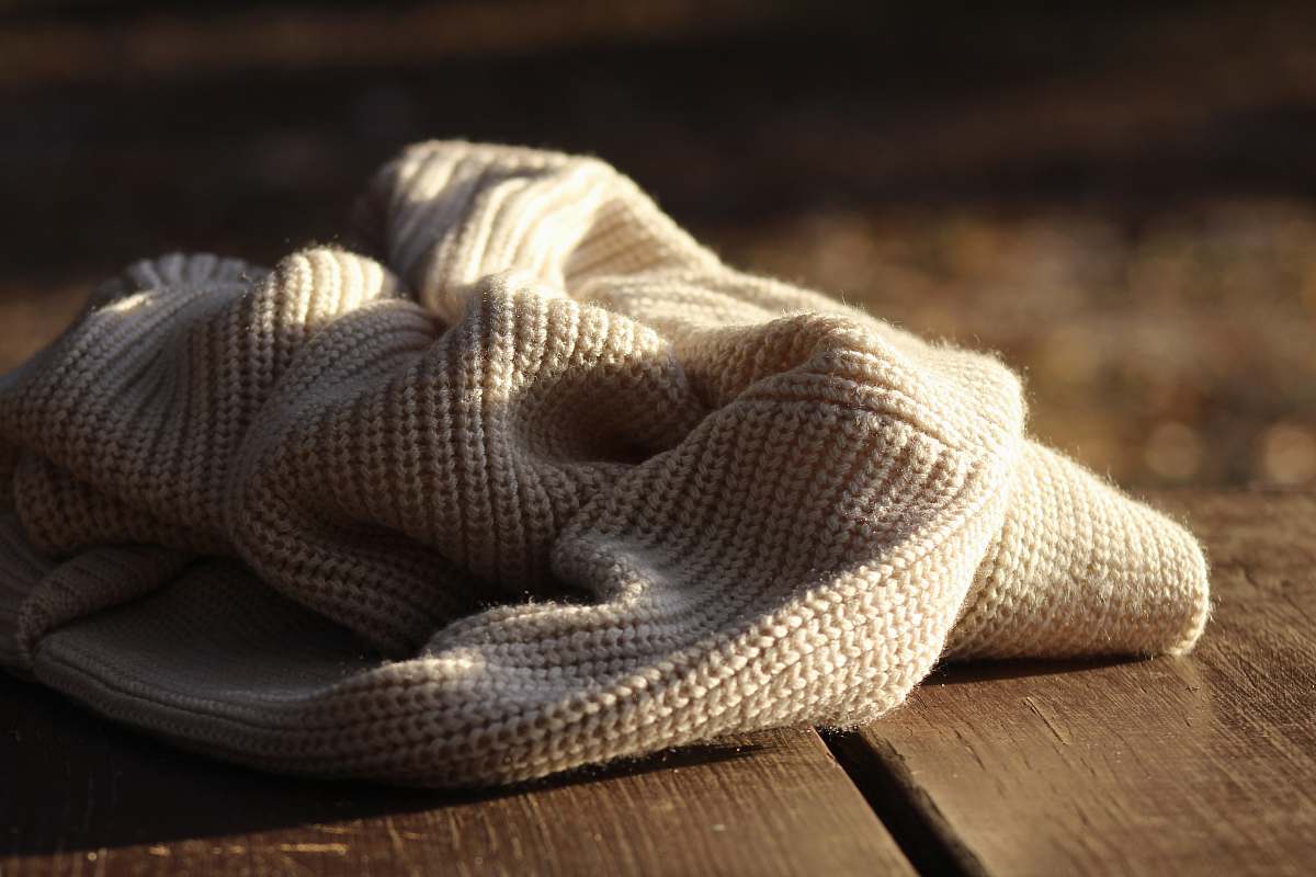 blanket white textile on wooden plank brooksville